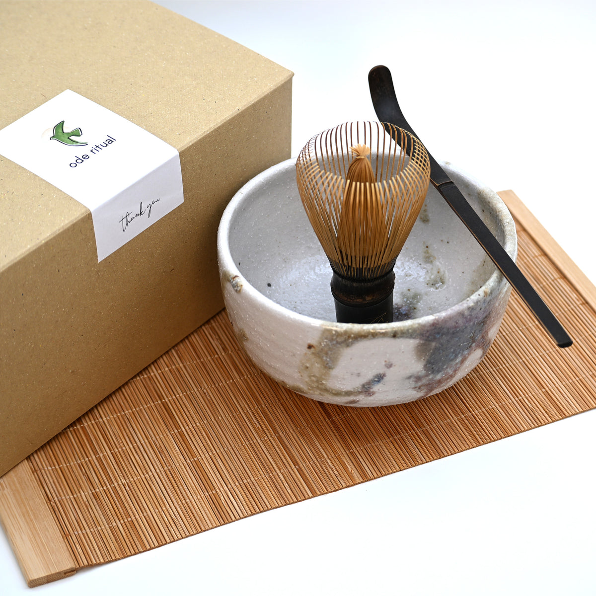 4-piece Japanese matcha starter set with Kyoto chawan, purple bamboo chasen whisk and scoop