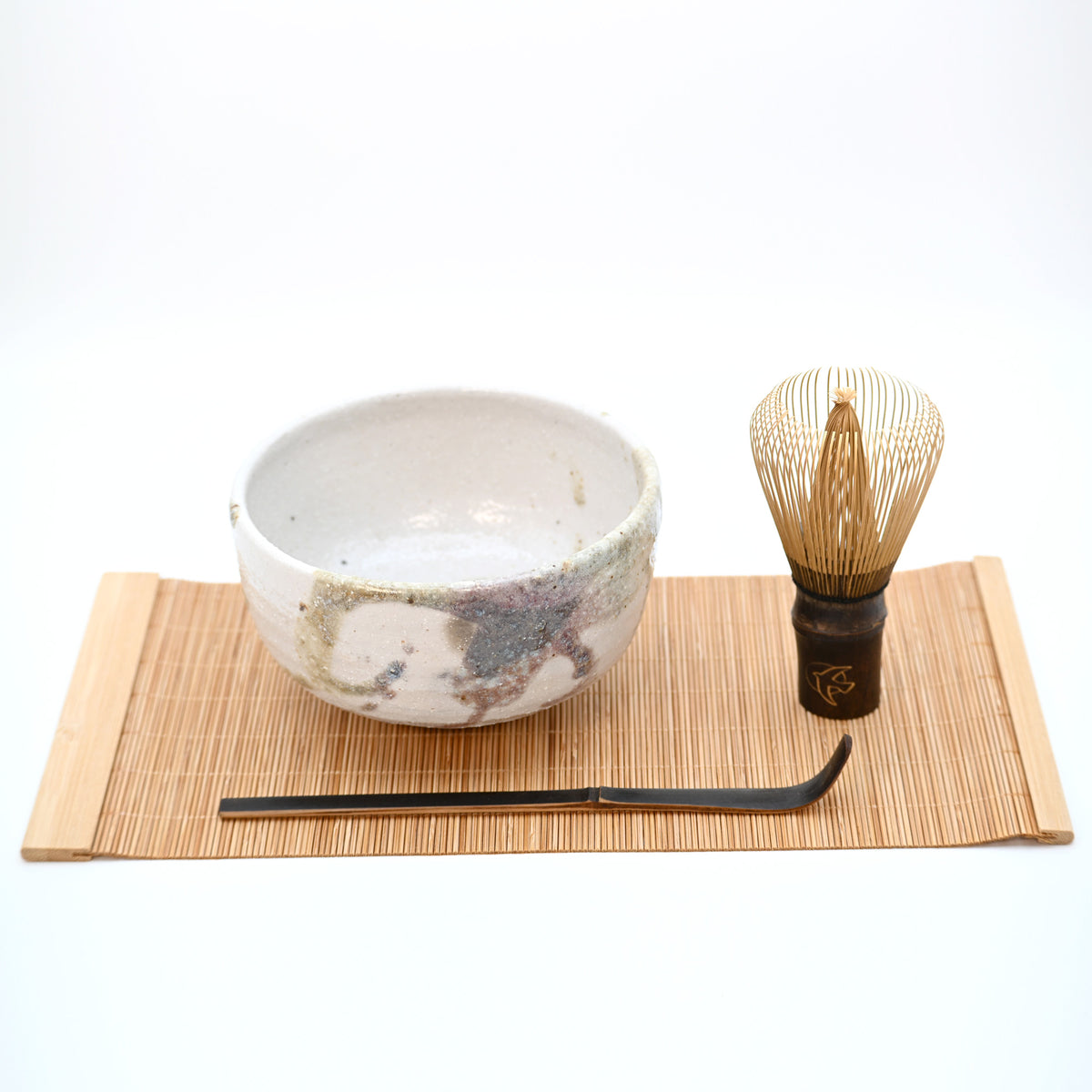 4-piece Japanese matcha starter set with Kyoto chawan, purple bamboo chasen whisk and scoop